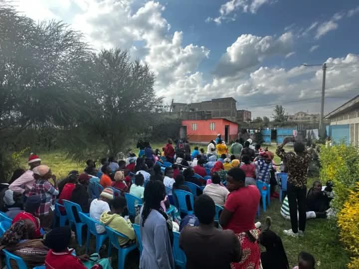 A large crowd gathered outdoors for a community forum