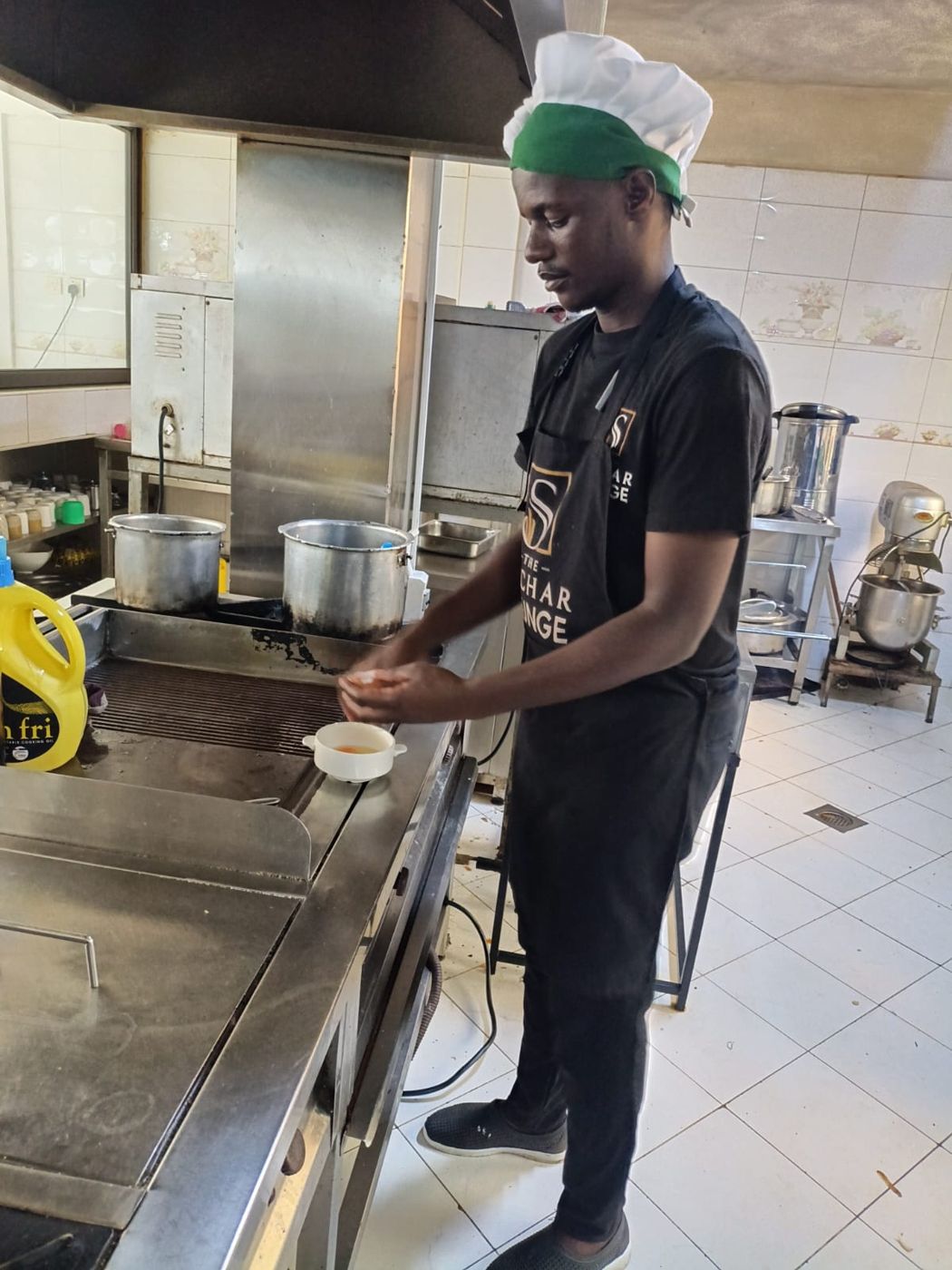 A young chef preparing food